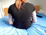 Lea wearing five very tight hose clamps on each arm