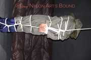 Sexy Sandra being tied and gagged overhead with ropes and a clothgag hodded wearing a sexy rainwear combination (Pics)
