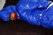 Simone tied and gagged in a shiny nylon downcoat