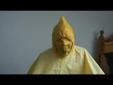 Jill tied and gagged on a chair wearing a yellow rainsuit and coveres with an yellow raincoat with two hoods (Video)