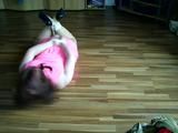 Sandra hogtied on the floor