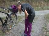 Get a Video with Sandra riding her bike enjoying her shiny nylon Rainwear