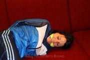 Isabelle tied and gagged in shiny nylon clothes