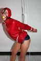 Alina tied and gagged in shiny nylon shorts and a shiny nylon cagoule