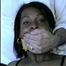 FEISTY NAFISA, TIED IN BLUE JEANS, CLEAVE & TAPED GAGGED HOSTAGE (D26-2)