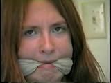 24 Yr OLD CRAFTER IS CLEAVE GAGGED, MOUTH STUFFED, HAND GAGGED, OTM GAGGED & TIED TO A CHAIR (D55-6)
