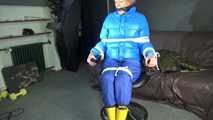 Sexy Pia being tied and gagged with ropes and a cloth gag on a hairdressers chair wearing a sexy blue shiny nylon rainpants and a lightblue downjacket (Video)