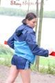 Enni wearing sexy shiny nylon shorts and rain jacket while stretching herself on a sea (Pics)