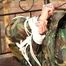 Pia tied, gagged and hooded in a princess bed wearing a sexy shiny camouflage rainwear (Pics)