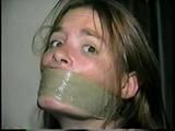 24 Yr OLD CRAFTER IS WRAP TAPE GAGGED, BAREFOOT TICKLED, TOE-TIED, BALL-TIED, HANDGAGGED & MOUTH STUFFED (D61-1)