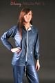 Alina posing in a studio wearing a supersexy blue rainwear combination (Pics)