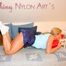Blonde archive girl wearing a darkblue shiny nylon shorts and a white top posing on a sofa (Pics)