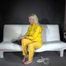 Watching Pia preparing her sofa with a shiny nylon cloth wearing a yellow shiny nylon rainsuit enjoying herslef on the sofa (Video)
