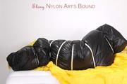 Jill tied and gagged in an big shiny down bag to lie in (Pics)