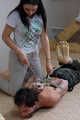 Hazel dominates Gregory, bit-gagged and hogtied with his hands in reverse prayer