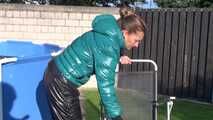 Watch Sandra in her shiny nylon Downwear outside in the Sun 