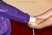 Isabelle tied and gagged in shiny nylon clothes