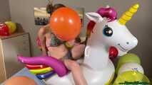 nail2pop promotional balloons on inflatable unicorn and destroying it with a pen