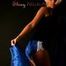 Blonde archive girl posing in a studio with a nylon scarf wearing a sexy blue shiny nylon shorts and a black top (Pics)