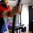 Pia tied and gagged on a crosstrainer for doing her workout right wearing a sexy blue shiny nylon shorts and an oldschool rain jacket (Pics)
