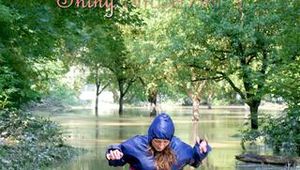 Stella jumping in puddles wearing sexy blue shiny nylon rainwear and rubber boots (Pics)