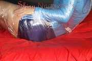 Watching sexy Pia being envelopped in film wearing a sexy blue shiny nylon shorts and a lightblue shiny nylon rainjacket (Pics)