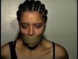 18 Yr OLD STUDENT SHANNA IS WRAP TAPE GAGGED, DUCT TAPE TIED, BAREFOOT, TOE-TIED, HANDCUFFED, MOUTH STUFFED, HANDGAGGED WHILE SITTING ON THE BED (D67-15)