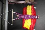 Watching sexy Sonja wearing a supersexy purple shiny nylon rainwear combination being tied and gagged overhead with ropes and a clothgag (Pics)
