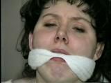 19 Yr OLD JENNIFER IS MOUTH STUFFED, TAPE GAGGED, TIED WITH ARMS OUT AND TO 2 PILLARS & CLEAVE GAGGED (D48-10)d, bondage