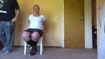 Cuffed on a chair 001
