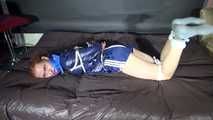 ***RONJA*** being tied and gagged on a sofa with ropes and a clothgag wearing a sexy blue shiny nylon shorts and a rainjacket (Video)