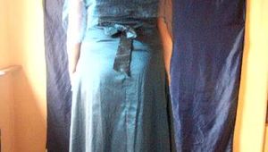 Tied up in a blue Dress with handcuffs