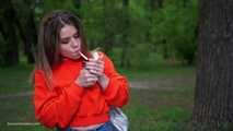 Pretty Kate is smoking Marlboro Red 100s in the park