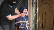 Marie bound and gagged in shiny nylon Rainwear