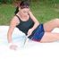 Enni sunbathing on a lake wearing sexy shiny nylon shorts and a top (Pics)