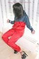 Stella tied and gagged on a heater wearing sexy shiny nylon rainwear and high heels (Pics)