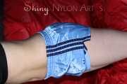 Watching ***NEW MODELL COURTNEY*** wearing a sexy lightblue shiny nylon shorts and a black top being tied and gagged overhead with ropes and a ballgag (Pics)