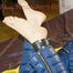 Lucy tied and gagged with a pillory wearing a sexy blue down pants and a pink down jacket (Pics)
