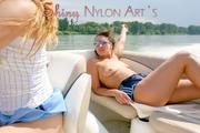 Stella and Leonie on a boat wearing sexy shiny nylon shorts and bikini tops (Pics)