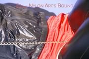 Mara ties and gagges herself with hand cuffs on a sofa wearing a supersexy black Leggings and a shiny nylon shorts and a rain jacket (Pics)