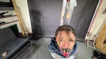 Marie taped and suspended in shiny nylon Rainwear