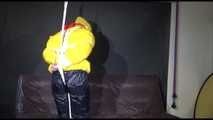 MARA tied and gagged overhead with ropes and a ballgag wearing a super sexy super shiny black rain pants, rubber boots and a yellow down jacket (Video)