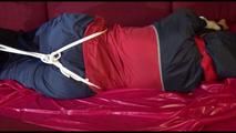 Lucy tied, gagged and hooded on a sofa wearing an oldschool rainwear combination (Video)
