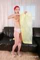 Morrigan - posing in yellow trash bag dress