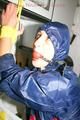 Stella tied, gagged and hooded in the kitchen wearing supersexy blue rainwear (Pics)