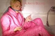 Sonja ties and gagges herself in the bath tub with cuffs wearing sexy shiny nylon downwear (Pics)
