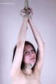 Tracy: topless barefoot girl with noose on her neck, having her to stand on her tip toes to breathe, is tickled by camera man