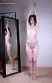 Tracy: topless barefoot girl with noose on her neck, having her to stand on her tip toes to breathe, is tickled by camera man