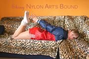 Beautiful archive girl tied and gagged wearing an wonderful red shiny nylon shorts and a shiny red rain jacket (Pics)