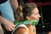 Watching sexy Sandra wearing a sexy green shorts and a white top being tied and gagged on the floor with ropes and a cloth gag (Pics)